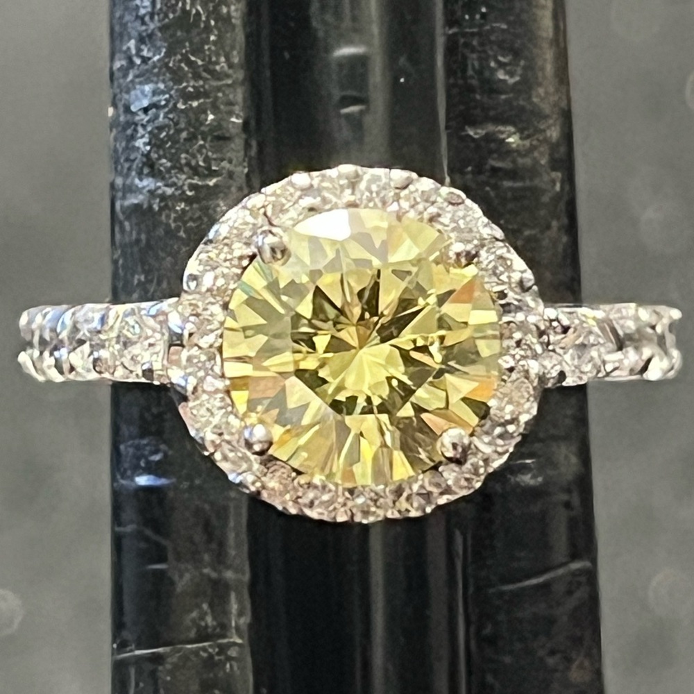 Elegant Silver and Yellow Gemstone Ring